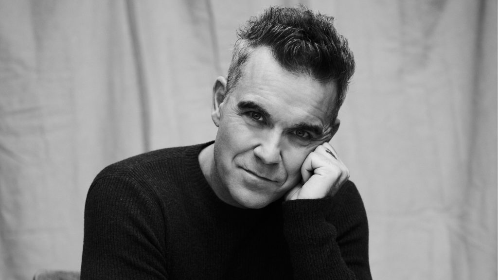 De volta ao país após 20 anos, Robbie Williams quer ‘viver o Brasil de verdade’ pela primeira vez